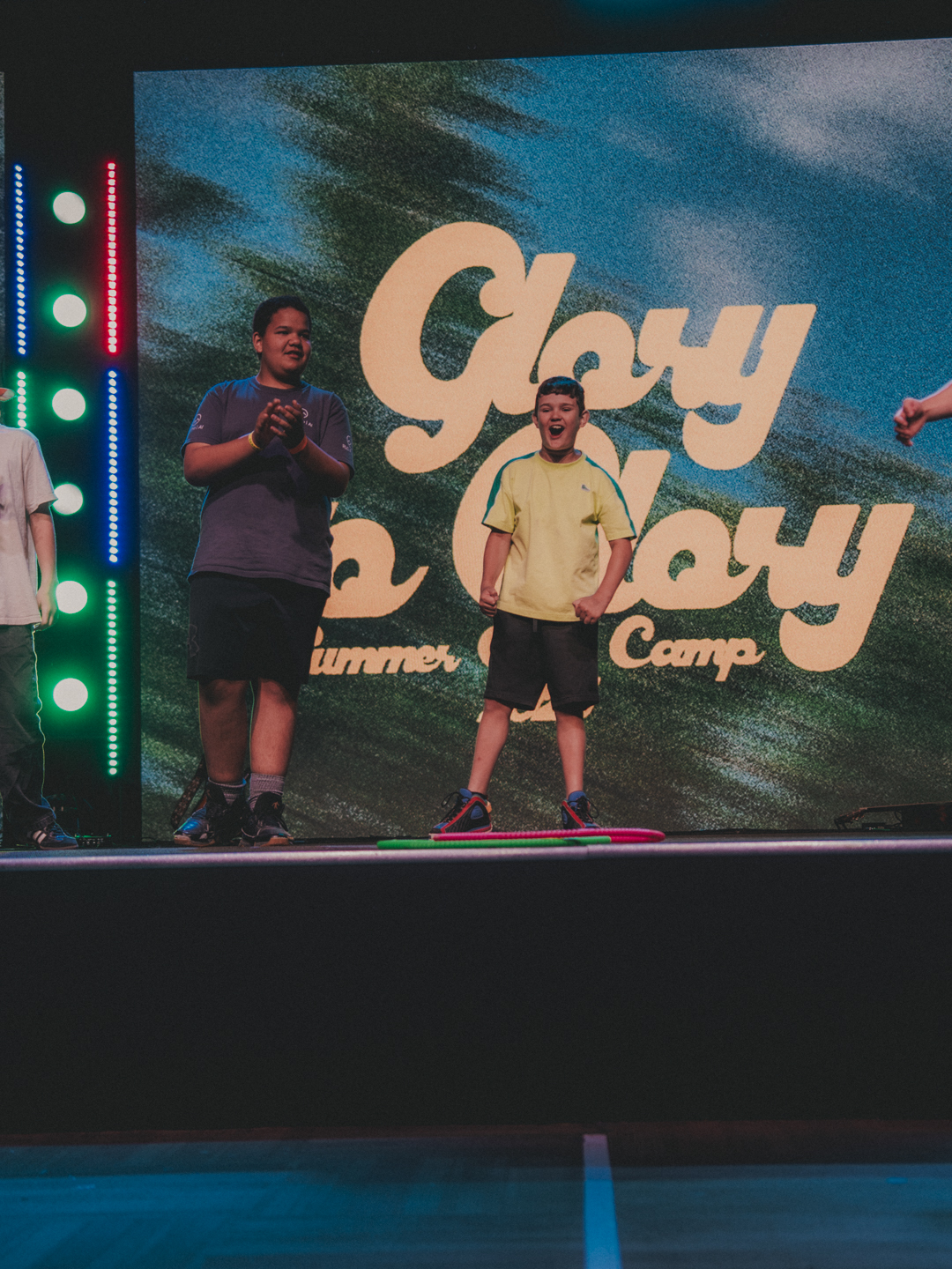 Students celebrating on stage at NW Youth summer camp